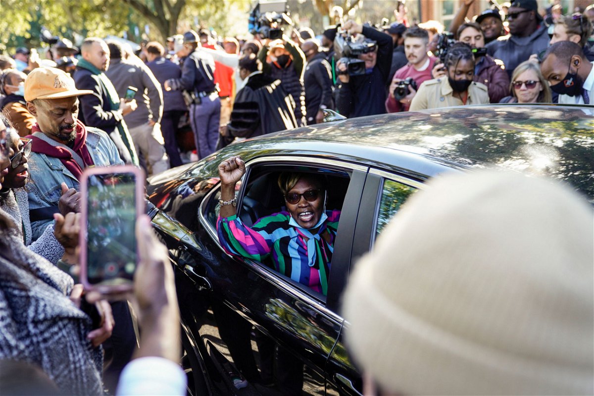 <i>Nicole Craine/The New York Times/Redux Pictures</i><br/>Ahmaud Arbery's mother Wanda Cooper-Jones gestures to supporters as she leaves the Glynn County Courthouse in Brunswick