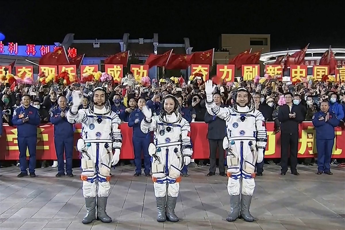 The three-member Shenzhou-13 crew at a departure ceremony on October 15 before their launch