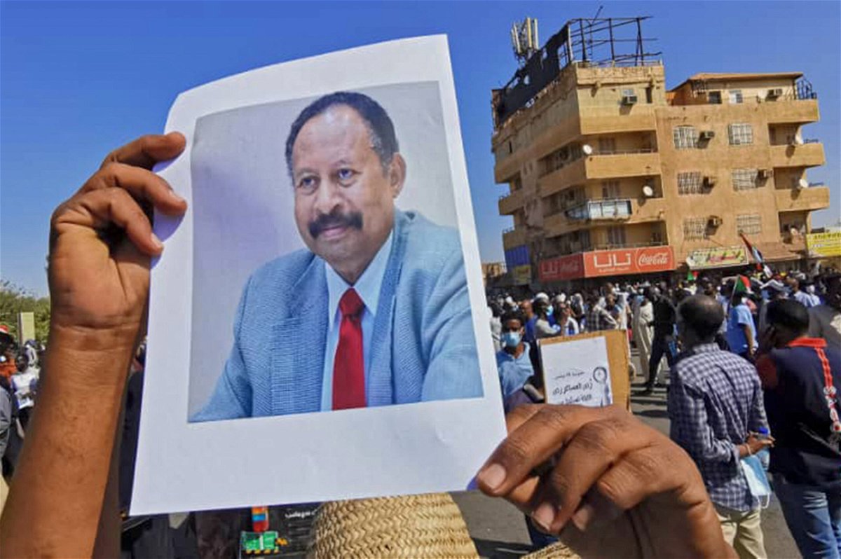 <i>AFP/Getty Images</i><br/>A Sudanese anti-coup protester carries a portrait of ousted Prime Minister Abdalla Hamdok at a demonstration in Khartoum on November 13.