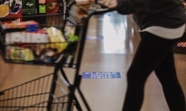 Kroger said on Friday a press release touting the acceptance of bitcoin cash at its stores this holiday season is fraudulent. A shopper walks past a social distancing marker at Kroger Marketplace in Versailles