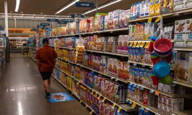 World food prices have surged to the highest level in more than a decade. A customer walks through the cereal aisle at a Albertsons Cos. brand Safeway grocery store in Scottsdale