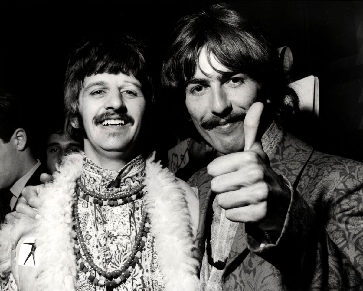 <i>Cummings Archives/Redferns/Getty Images</i><br/>Ringo Starr and George Harrison of the Beatles doing a thumbs up at the 'All You Need Is Love' session at Abbey Road Studios