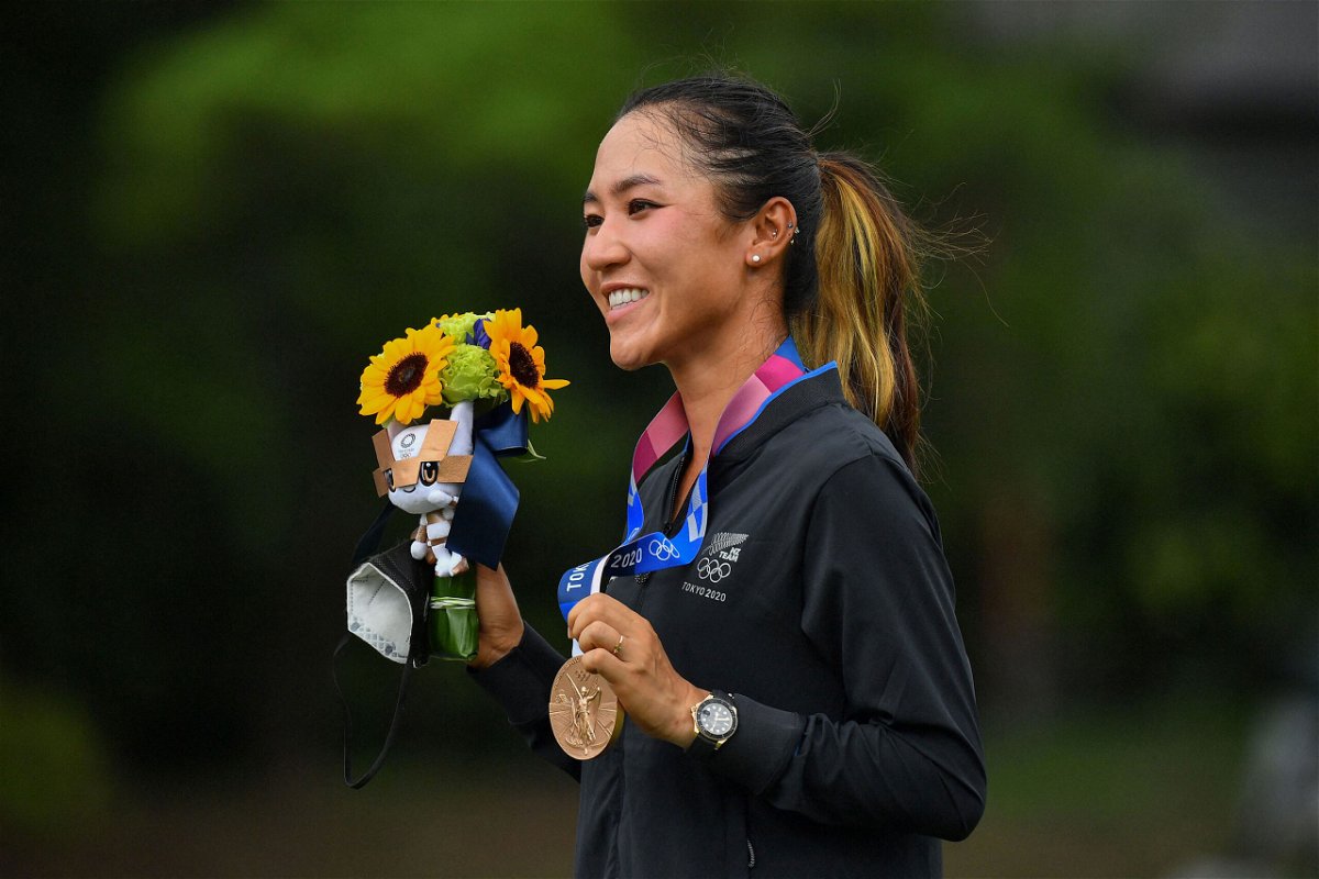 <i>Kazuhiro Nogi/AFP/Getty Images</i><br/>Ko poses with her bronze medal on the podium during the victory ceremony of the women's golf competition at the Tokyo 2020 Olympic Games.