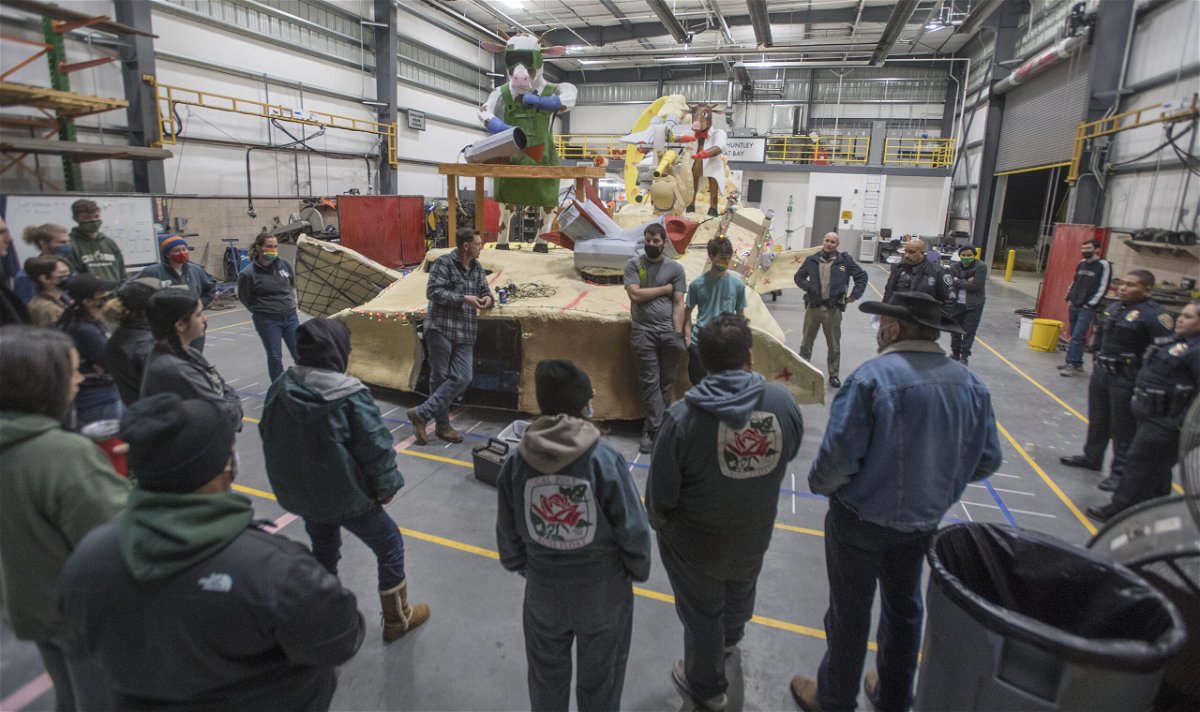 Strategy meeting as The Cal Poly Universities rose float 'Stargrazers,' heads to Pasadena from the Rose Float lab at Cal Poly Pomona December 19, 2021.