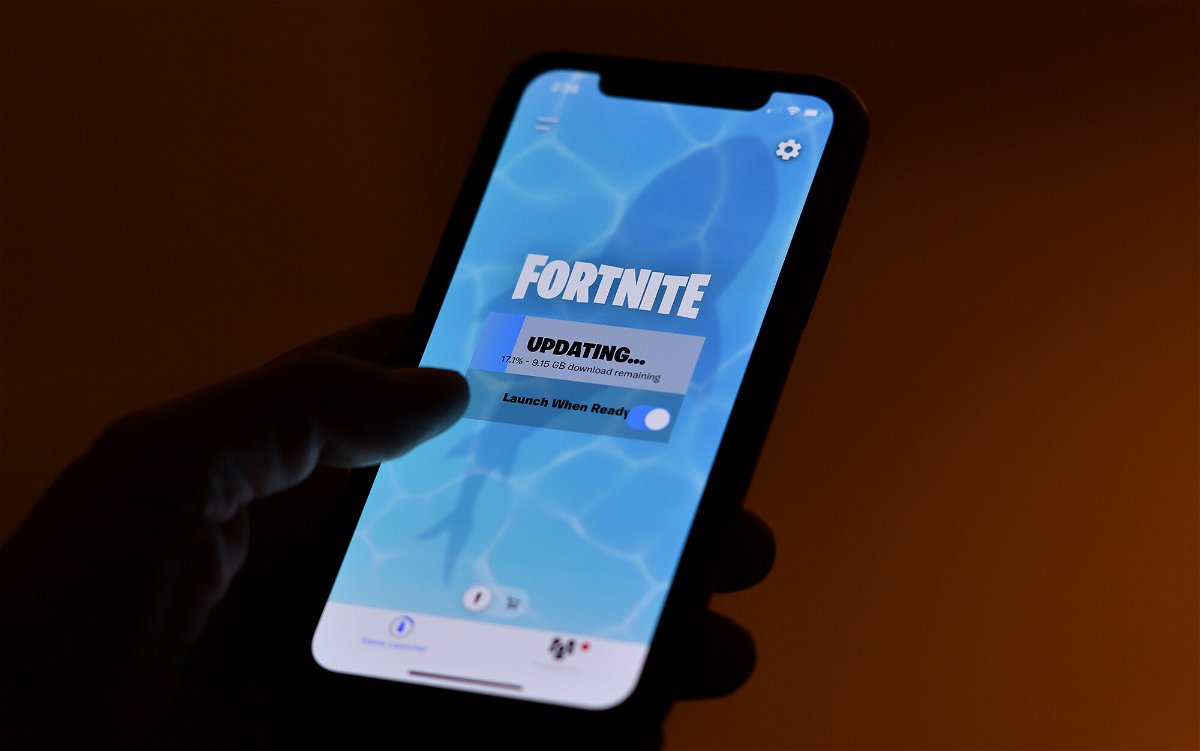 <i>Chris Delmas/AFP/Getty Images</i><br/>This illustration picture shows a person waiting for an update of Epic Games' Fortnite on their smartphone in Los Angeles on August 14