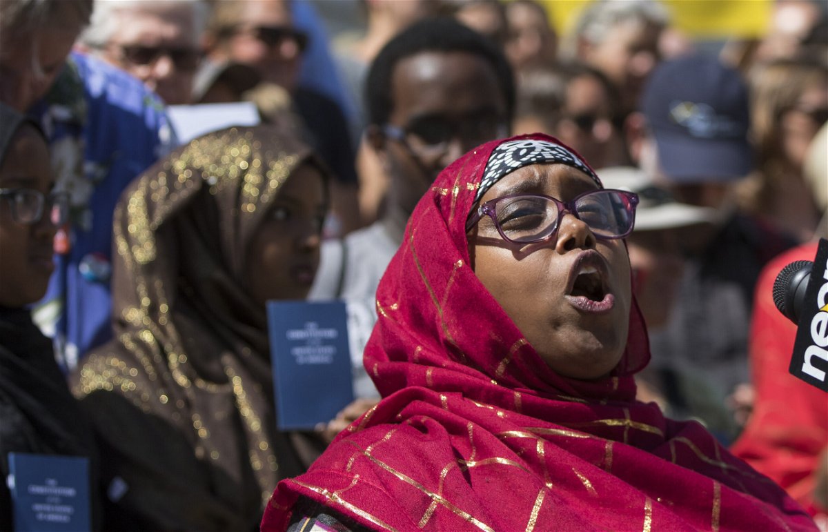<i>Ben McCanna/Portland Press Herald/Getty Images</i><br/>Deqa Dhalac speaks during a 2016 rally protesting comments by Donald Trump