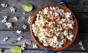 Freshly made popcorn spiked with fresh lime juice and zest is a tangy treat