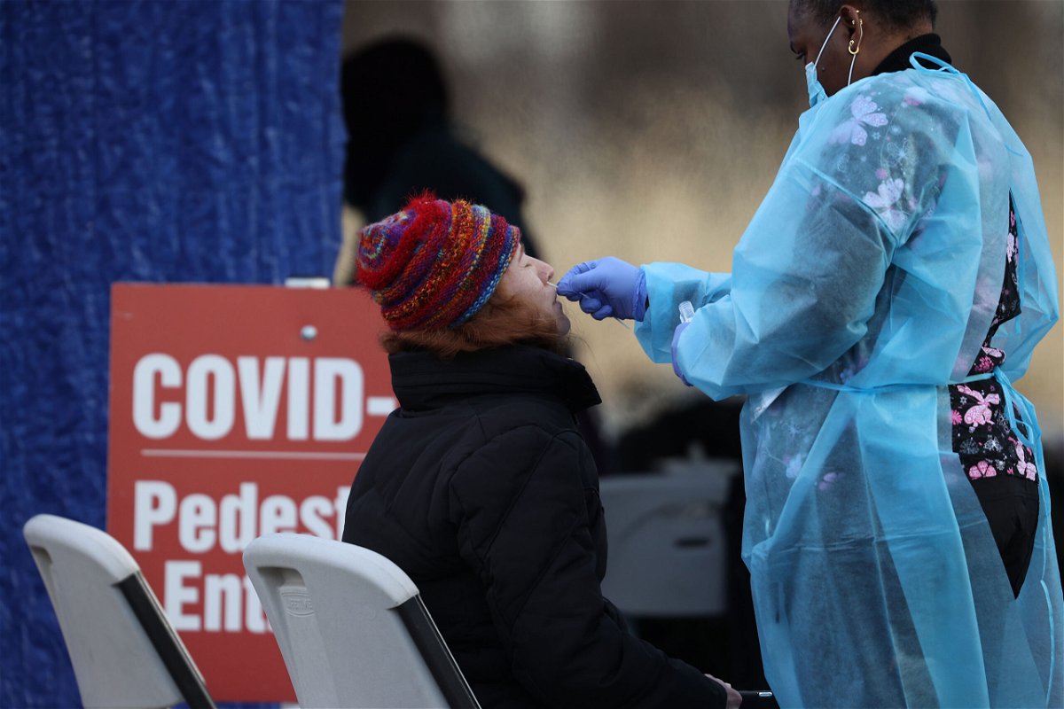 <i>Tayfun Coskun/Anadolu Agency/Getty Images</i><br/>A woman getting a Covid-19 test at a drive through testing center in North Bergen of New Jersey