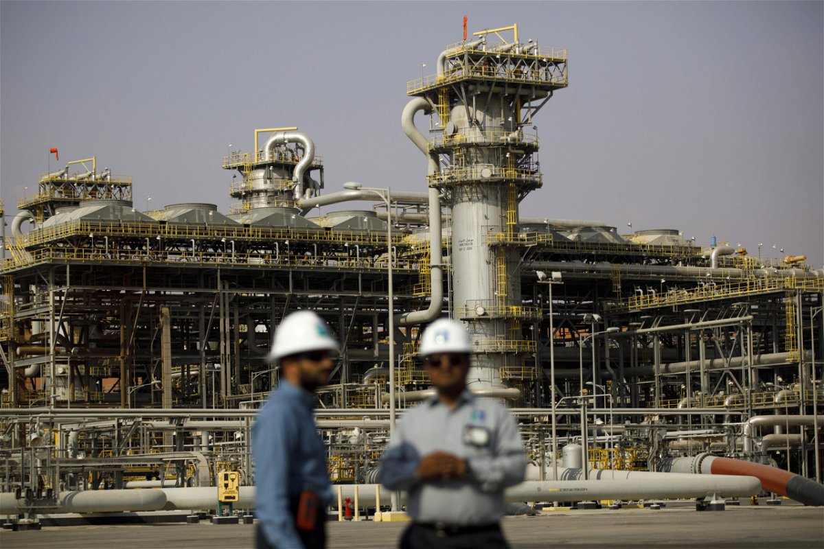 <i>Simon Dawson/Bloomberg/Getty Images</i><br/>Employees visit the Natural Gas Liquids (NGL) facility at Saudi Aramco's Shaybah oil field in the Rub' Al-Khali desert