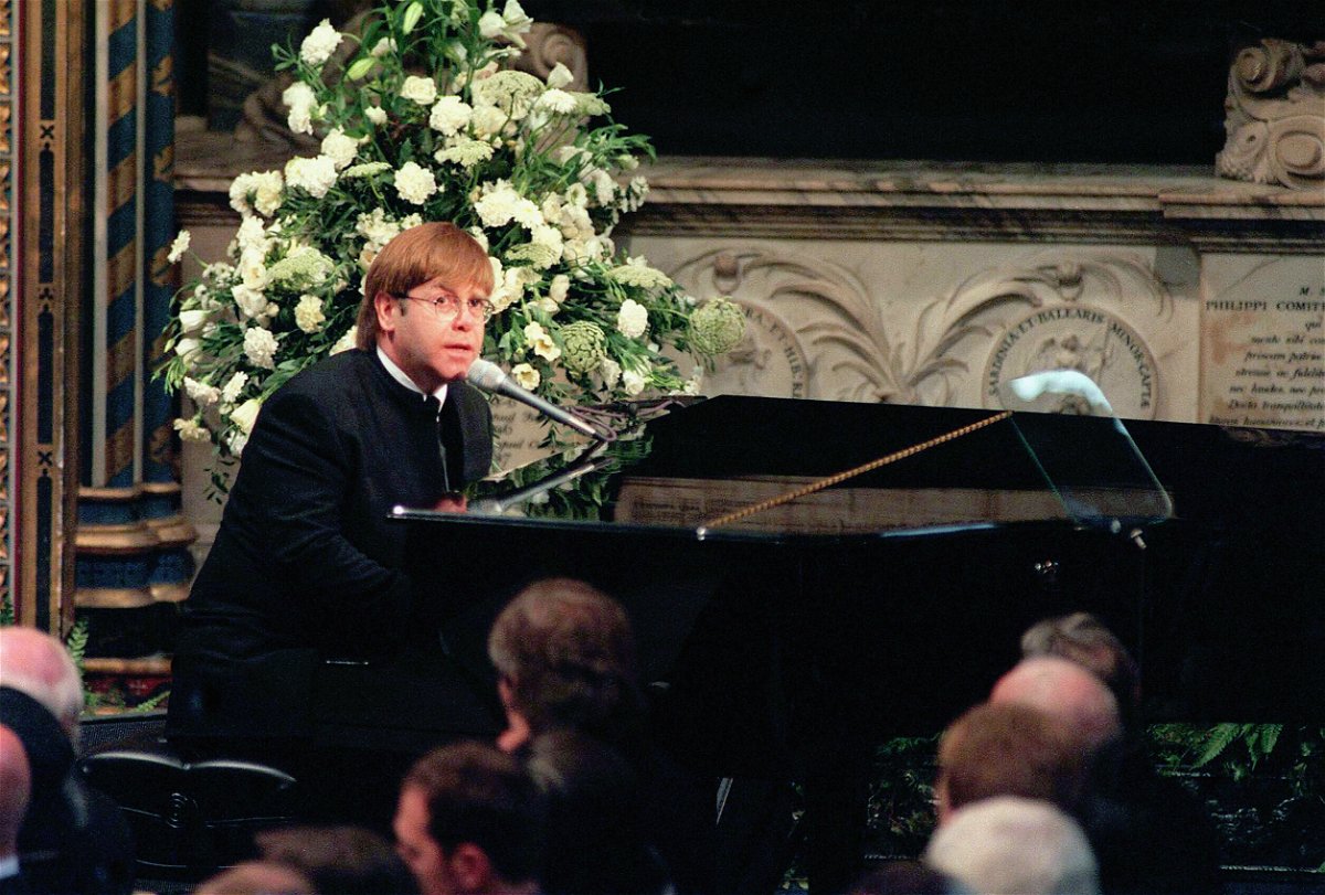 <i>Anwar Hussein/Hulton Archive/Getty Images</i><br/>Elton John is pictured singing at the funeral of Princess Diana in September 1997.