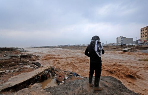 An Erbil resident takes a video of river water levels on the outskirts of the city.