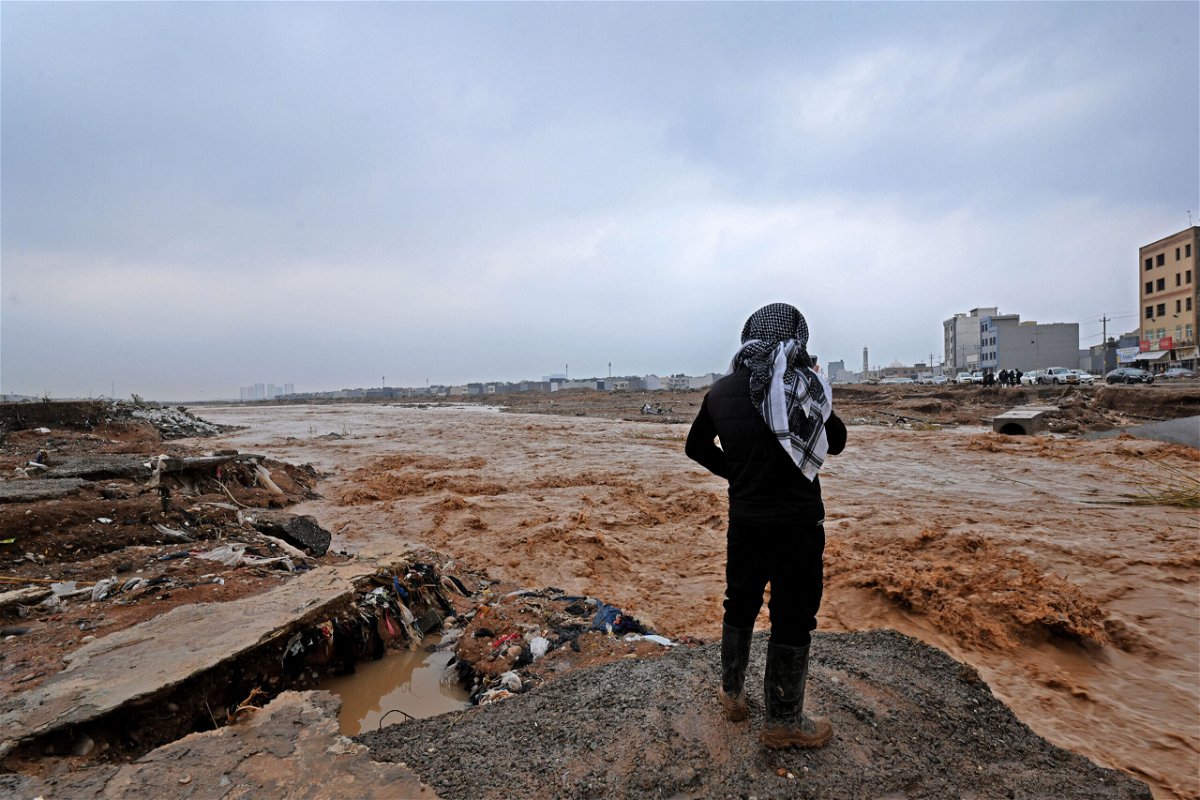 <i>AFP/Getty Images</i><br/>An Erbil resident takes a video of river water levels on the outskirts of the city.