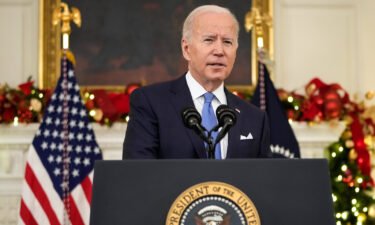 U.S. President Joe Biden speaks about the omicron variant of the coronavirus in the State Dining Room of the White House on December 21 in Washington