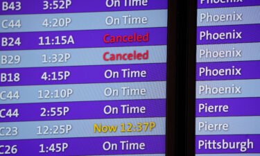 More than 200 flights were canceled by carriers out of Denver International because COVID-19 issues have created a shortage of workers. Canceled flights are noted in red on an electronic arrival board in the terminal of Denver International Airport on December 24.