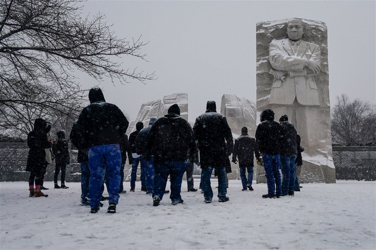 <i>Carolyn Kaster/AP</i><br/>Visitors look to the Martin Luther King