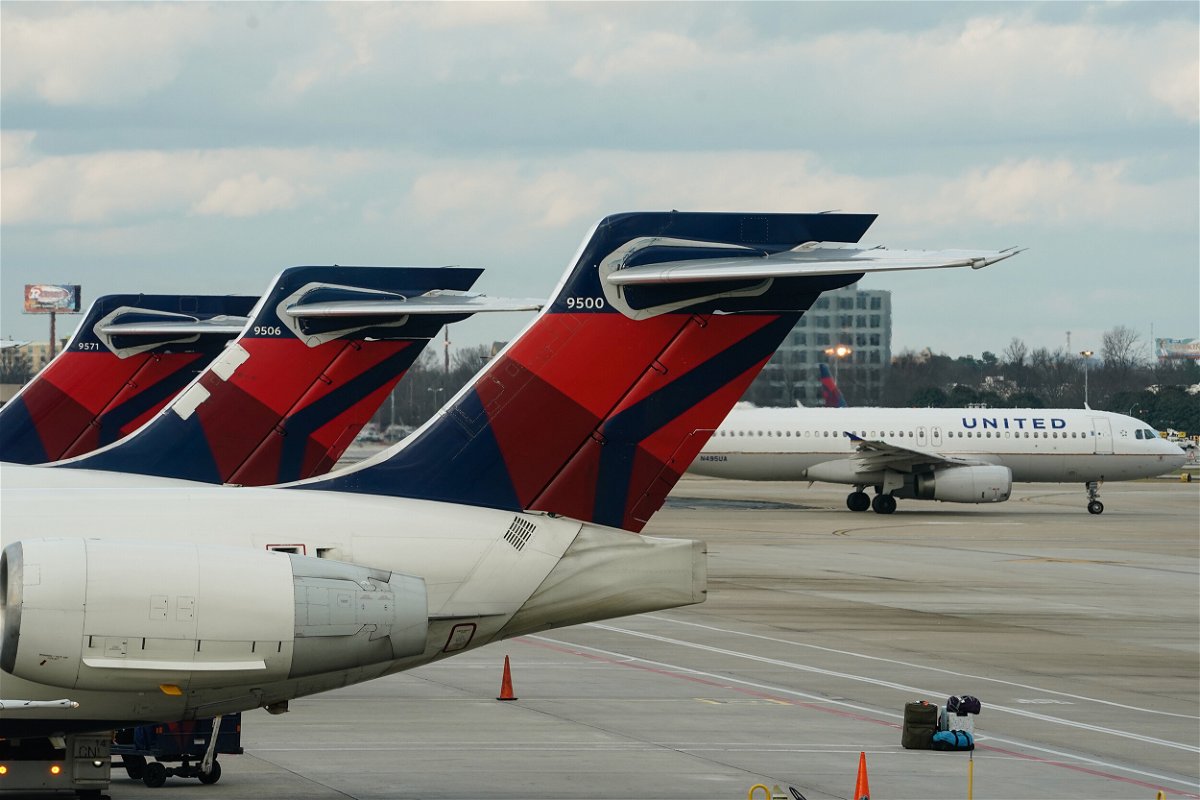 <i>Elijah Nouvelage/Bloomberg/Getty Images/FILE</i><br/>A man was arrested for allegedly creating multiple disturbances and exposing himself to a flight attendant and passengers during a Delta Air Lines flight.