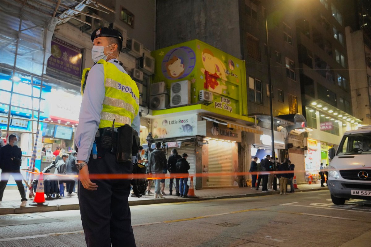 <i>Kin Cheung/AP</i><br/>A police officer stands guard outside a pet store that was closed after some pet hamsters tested positive for Covid-19 in Hong Kong on January 18.