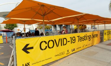 Los Angeles hits a record number of new infections. Pictured is a Covid-19 testing site at Los Angeles International Airport on December 6.