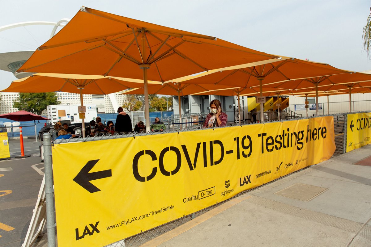 <i>Bloomberg/Bloomberg/Bloomberg via Getty Images</i><br/>Los Angeles hits a record number of new infections. Pictured is a Covid-19 testing site at Los Angeles International Airport on December 6.