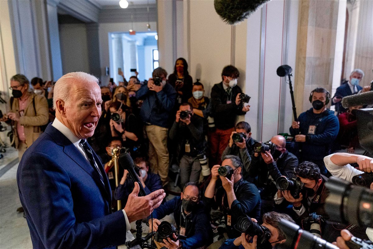 <i>Andrew Harnik/AP</i><br/>President Joe Biden speaks to members of the media as he leaves a meeting with the Senate Democratic Caucus to discuss voting rights and election integrity on Capitol Hill on January 13.