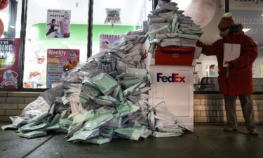At-home Covid-19 tests from Chicago Public Schools students pile up Tuesday at a FedEx drop box.