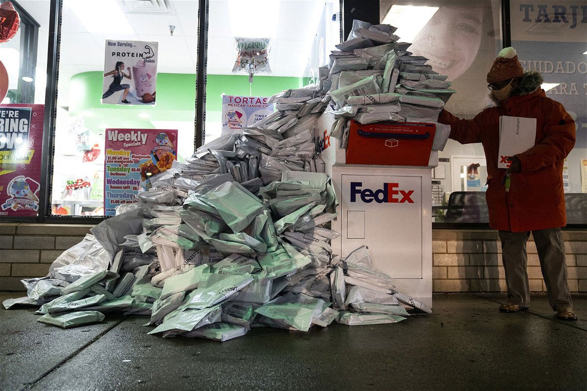 <i>E. Jason Wambsgans/Chicago Tribune/Tribune News Service/Getty Images</i><br/>At-home Covid-19 tests from Chicago Public Schools students pile up Tuesday at a FedEx drop box.