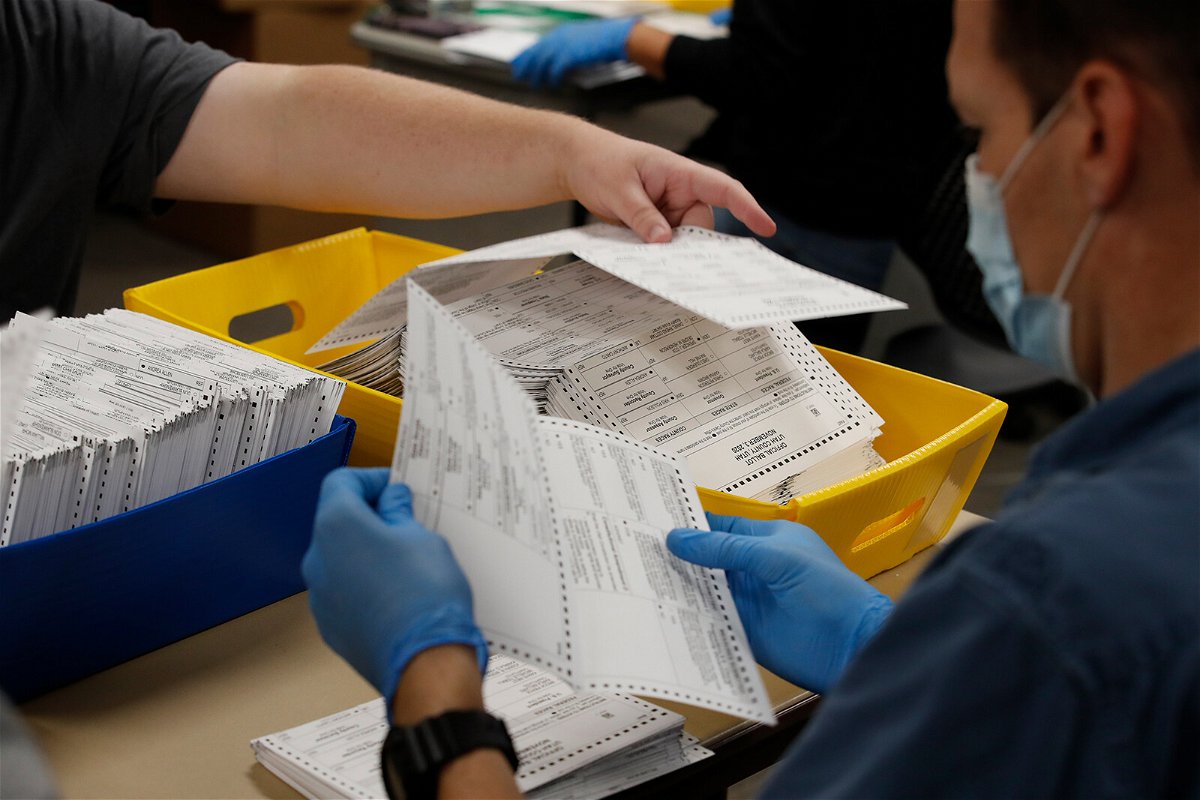 <i>George Frey/Bloomberg/Getty Images</i><br/>Election officials and volunteers process ballots for counting during the 2020 Presidential election in Provo