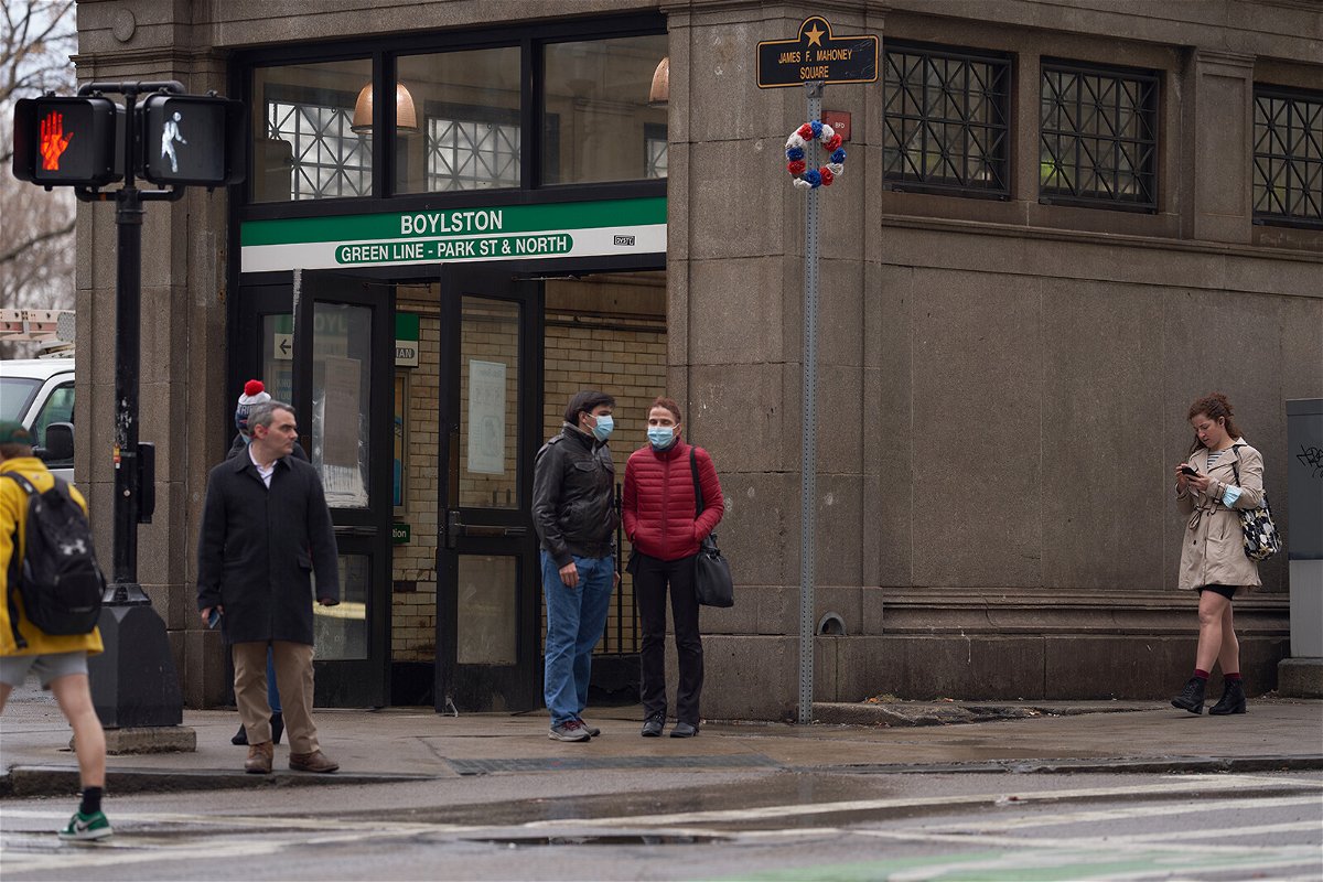 <i>Allison Dinner/Bloomberg/Getty Images</i><br/>A growing number of states and major cities are lifting Covid-19 restrictions. Pictured are commuters outside a subway station in downtown Boston