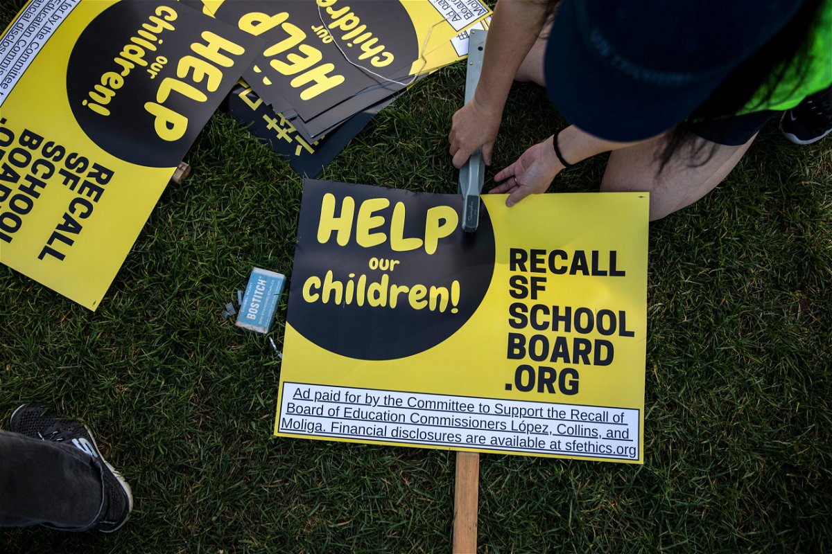 <i>Stephen Lam/The San Francisco Chronicle/Getty Images</i><br/>Michelle Wong makes a sign during a rally in support of the San Francisco School Board recall at Carl Larsen Park in San Francisco on February 12.