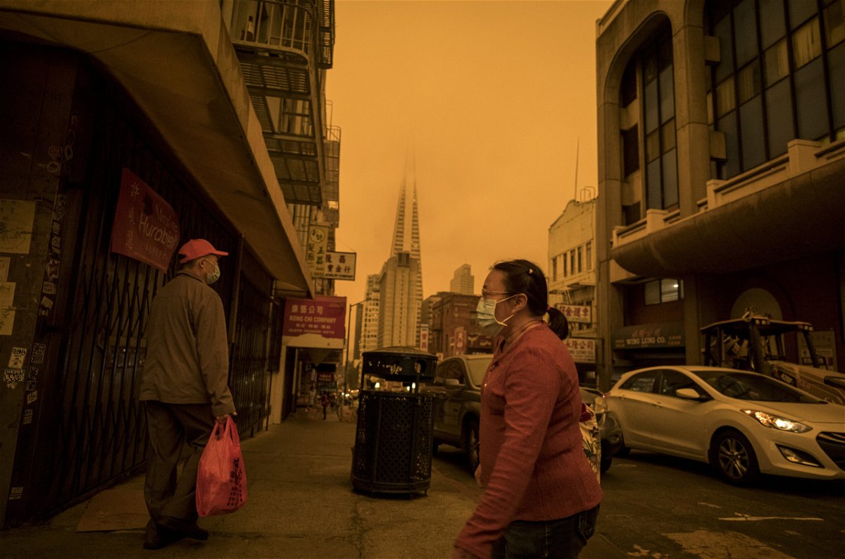 <i>David Paul Morris/Bloomberg/Getty Images</i><br/>Smoke hangs in the air in San Francisco in 2020 as destructive wildfires sweep across California. Communities of color are more likely to be on the front lines of the climate crisis
