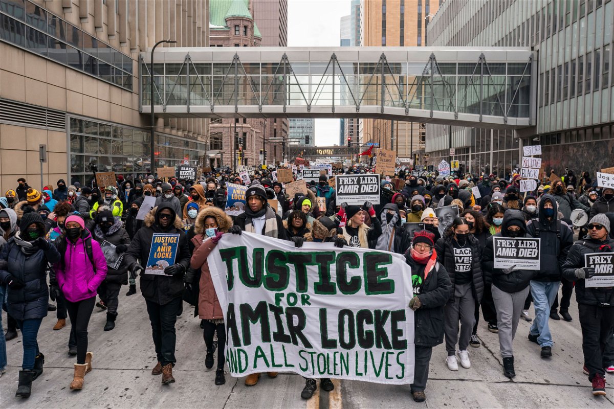 <i>Nathan Howard/Getty Images</i><br/>A racial justice march for Amir Locke moves through downtown Minneapolis on February 5