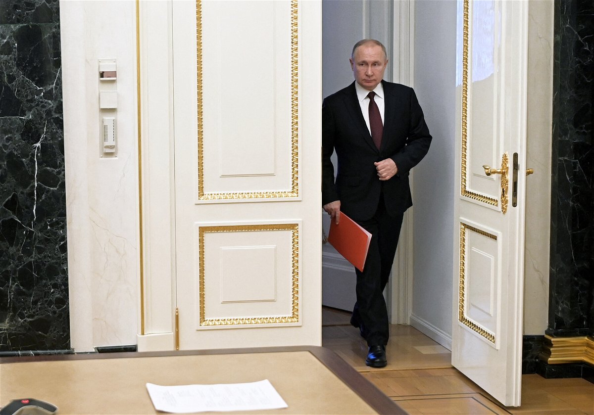 <i>Alexey Nikolsky/Sputnik/AFP/Getty Images</i><br/>Russian President Vladimir Putin arrives to chair a Security Council meeting via a video link in Moscow on February 25.