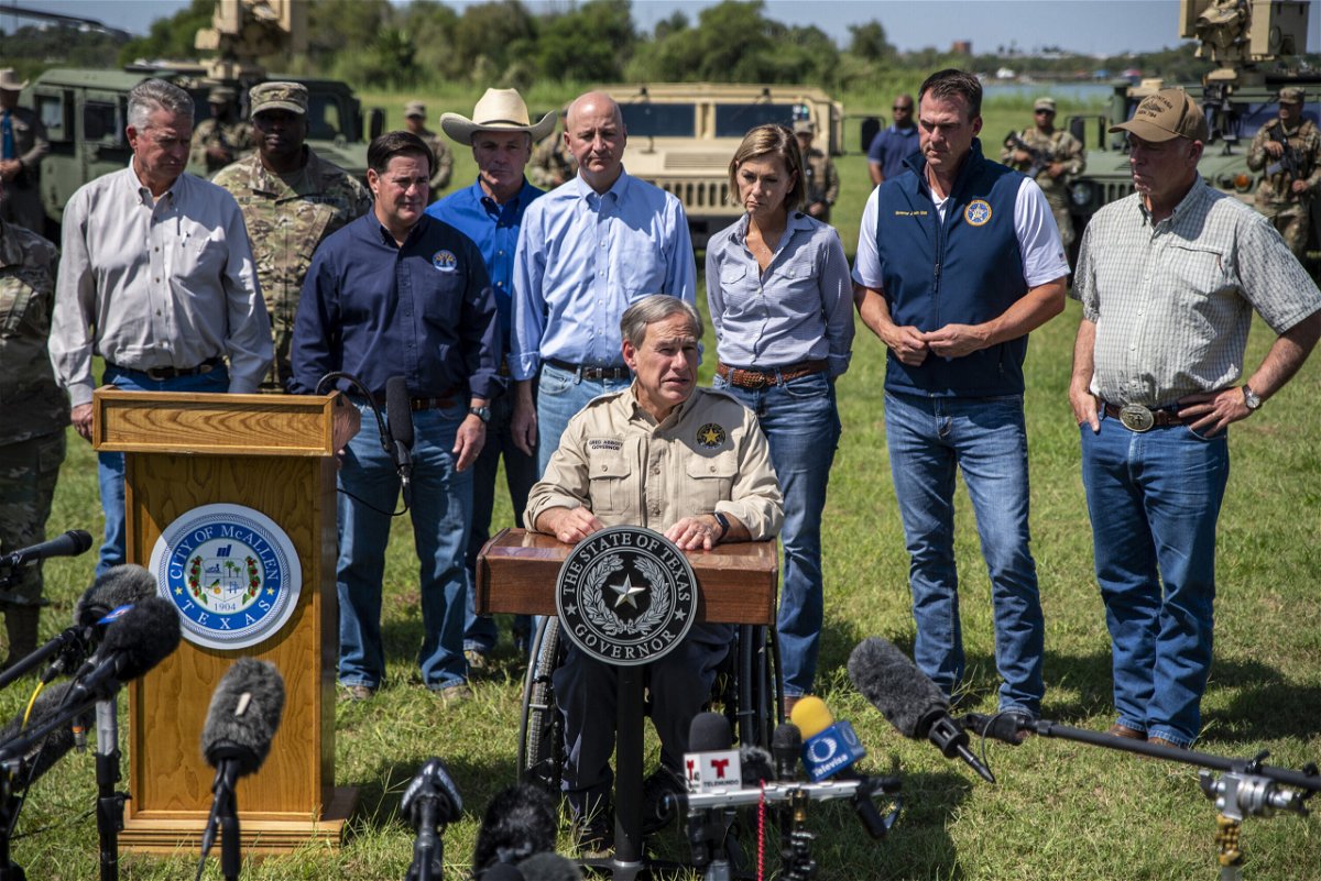 <i>Sergio Flores/Bloomberg/Getty Images</i><br/>Texas Gov. Greg Abbott speaks during a news conference in Mission