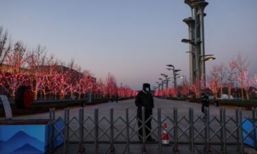 A security guard keeps watch at the boundary of the Beijing Olympic bubble on January 25.