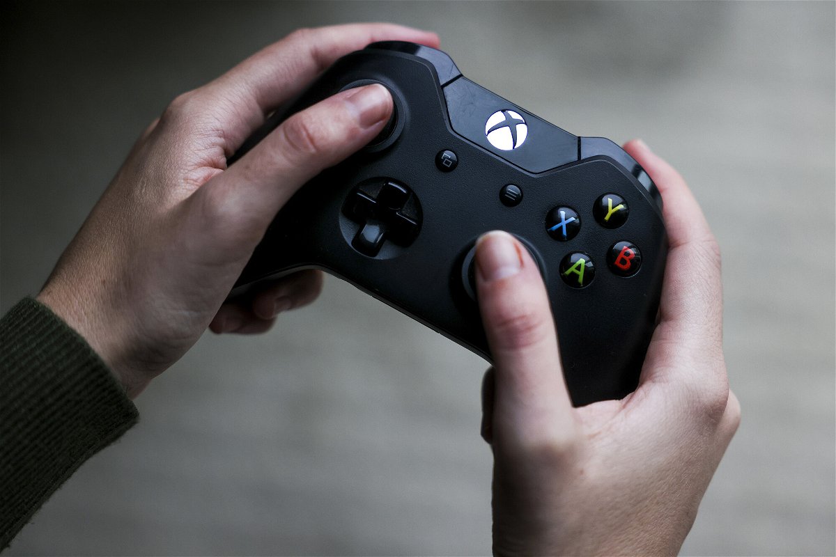 <i>Michael Ciaglo/Bloomberg/Getty Images</i><br/>A person uses a Microsoft's Xbox One video game controller in Denver