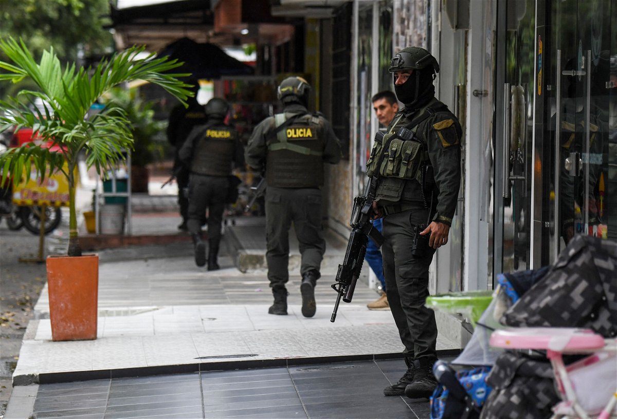 <i>Juan Barreto/AFP/Getty Images</i><br/>Colombia's National Police patrol the streets of Savarena