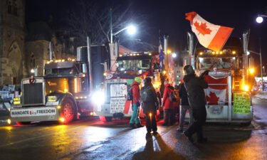 Trucks and protesters block downtown streets near the Parliament Buildings as a demonstration continues on February 16 in Ottawa