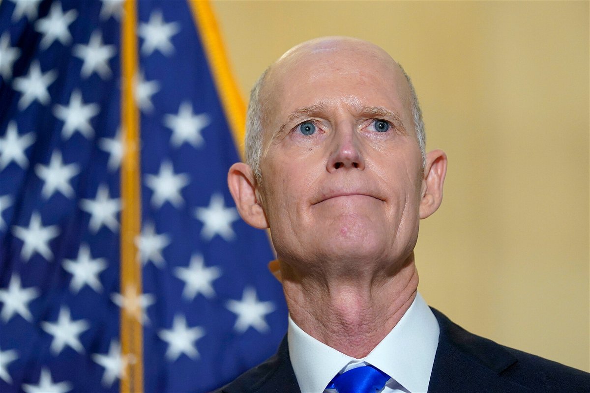 <i>Susan Walsh/AP/FILE</i><br/>Florida GOP Sen. Rick Scott talks with reporters on Capitol Hill on January 20.