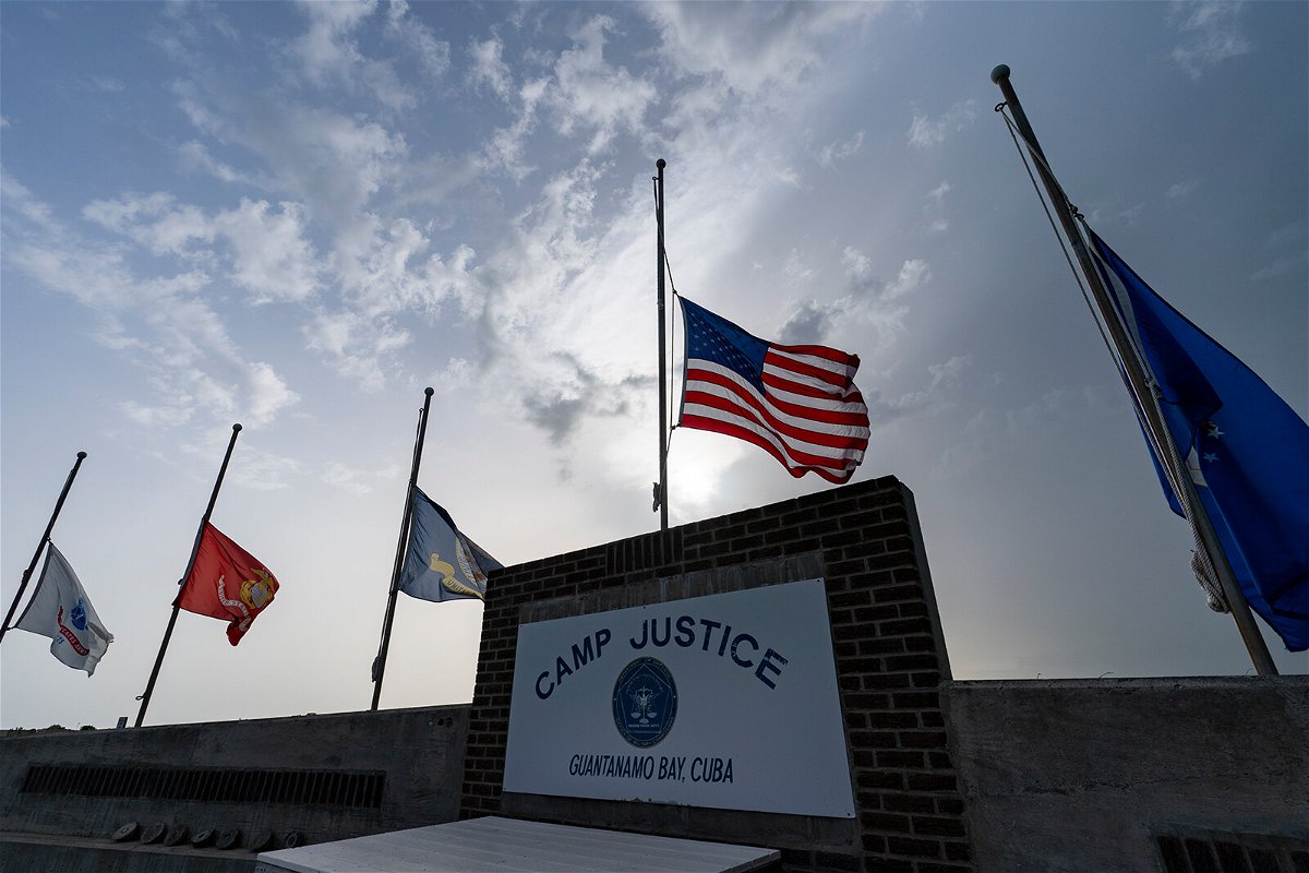 <i>Alex Brandon/AP</i><br/>Flags are seen flying at half-staff at Camp Justice