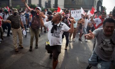 Demonstrators protest Peruvian President Pedro Castillo's government in Lima on Tuesday.