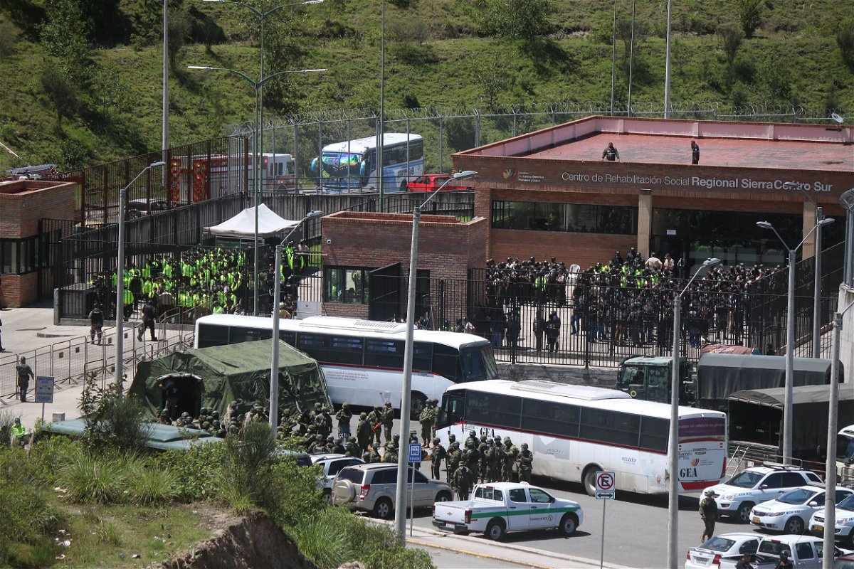 <i>Fernando Machado/AFP/Getty Images</i><br/>Police and military are seen outside Turi prison on April 4. Ecuadorian authorities said Monday they are in 