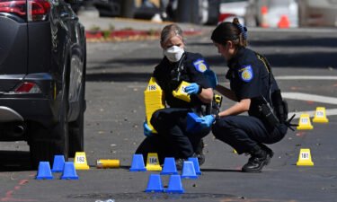 Sacramento Police crime scene investigators on 10th Street.