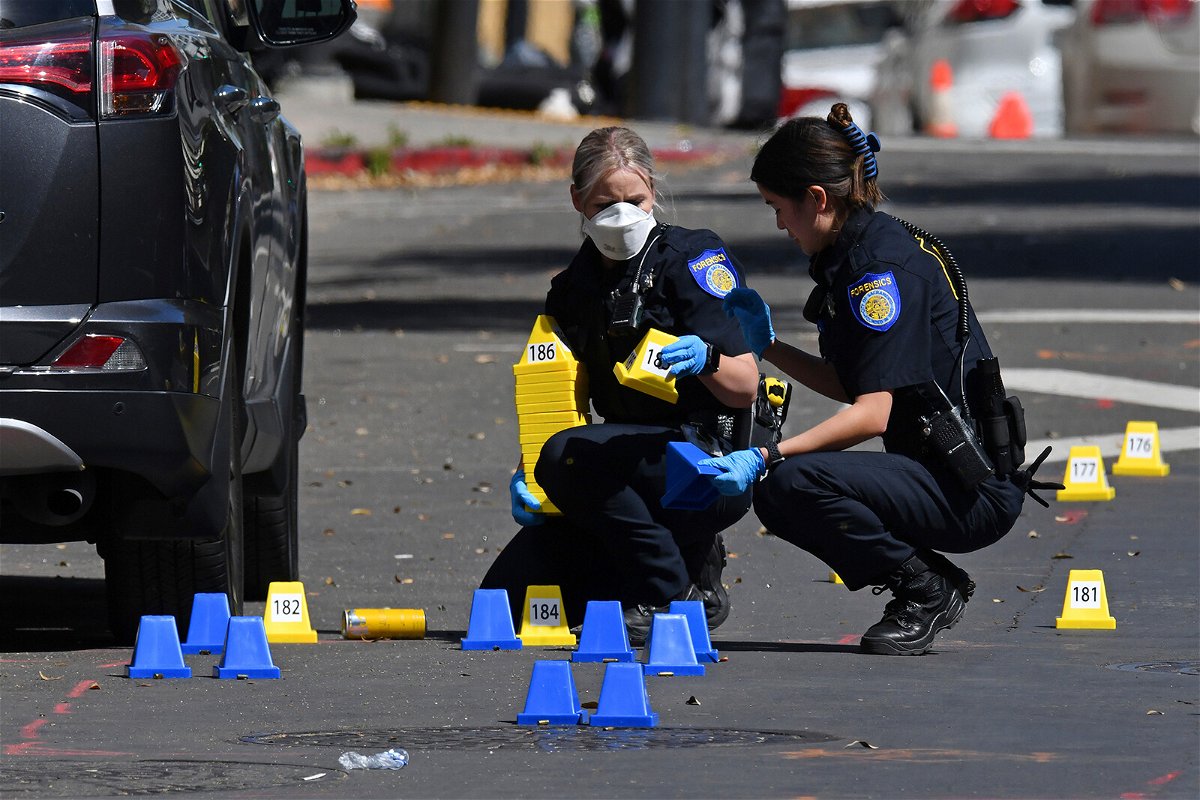 <i>Jose Carlos Fajardo/AP</i><br/>Sacramento Police crime scene investigators on 10th Street.