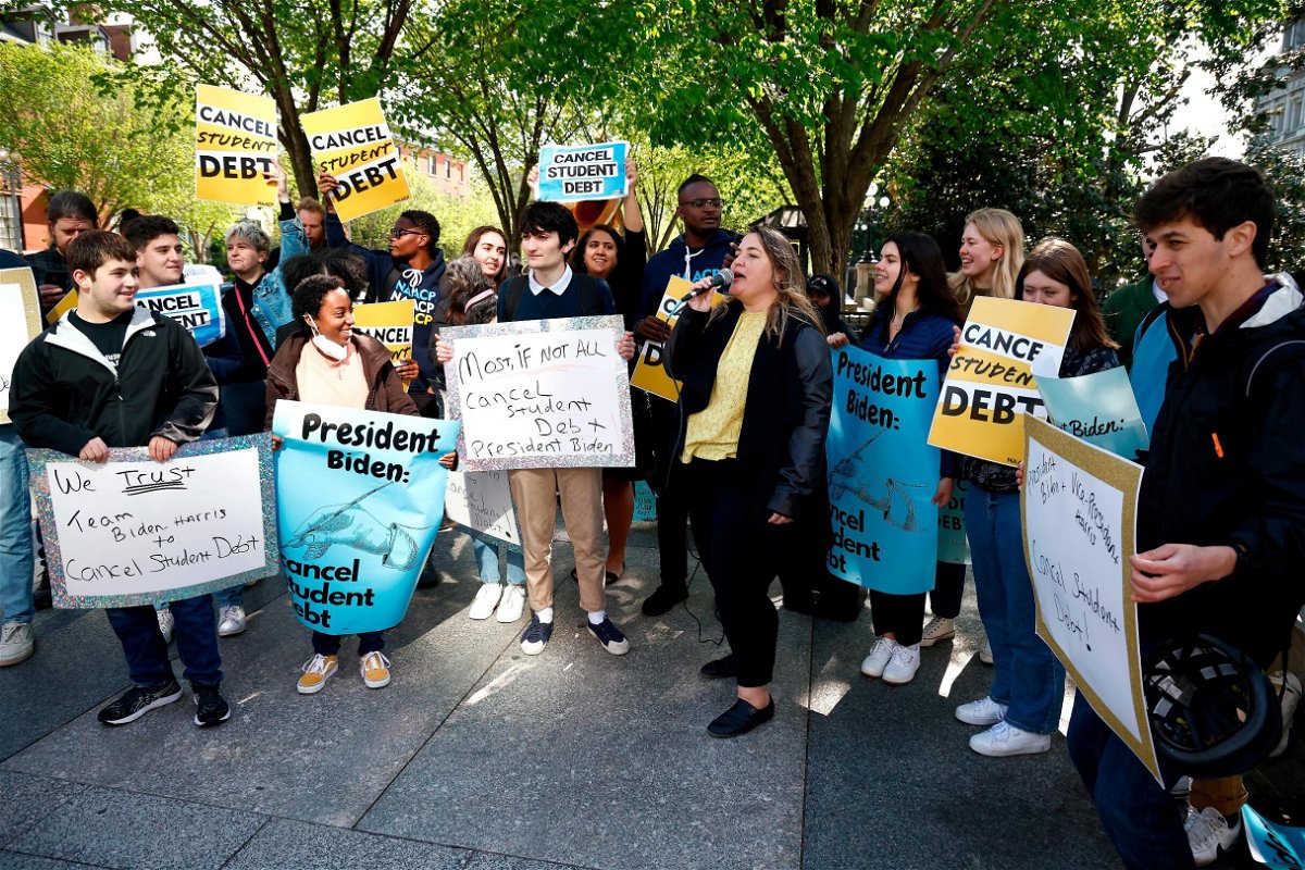 <i>Paul Morigi/Getty Images for We The 45 Million</i><br/>Melissa Byrne joins student debtors to once again call on President Biden to cancel student debt at an early morning action outside the White House with a brass band on April 27 in Washington