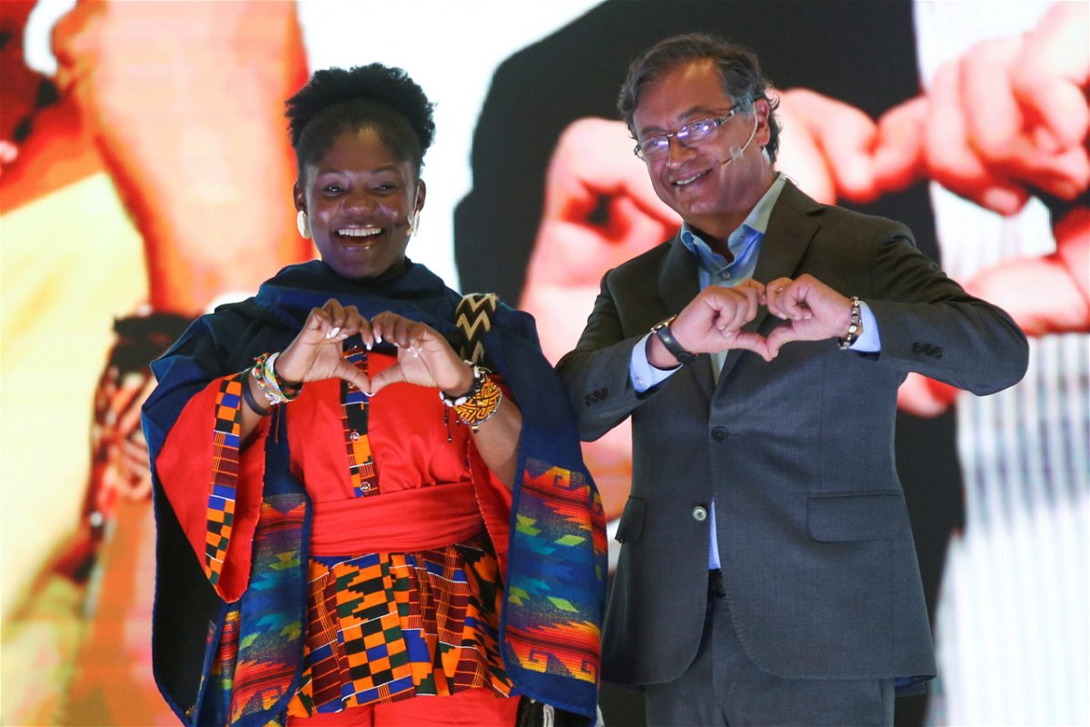 Colombian presidential candidate Gustavo Petro and his vice-presidential candidate Francia Marquez gesture during a presentation event in Bogota