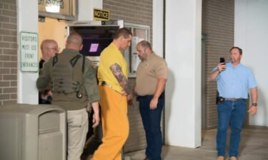 Casey White (center) is seen arriving at the Florence Courthouse.