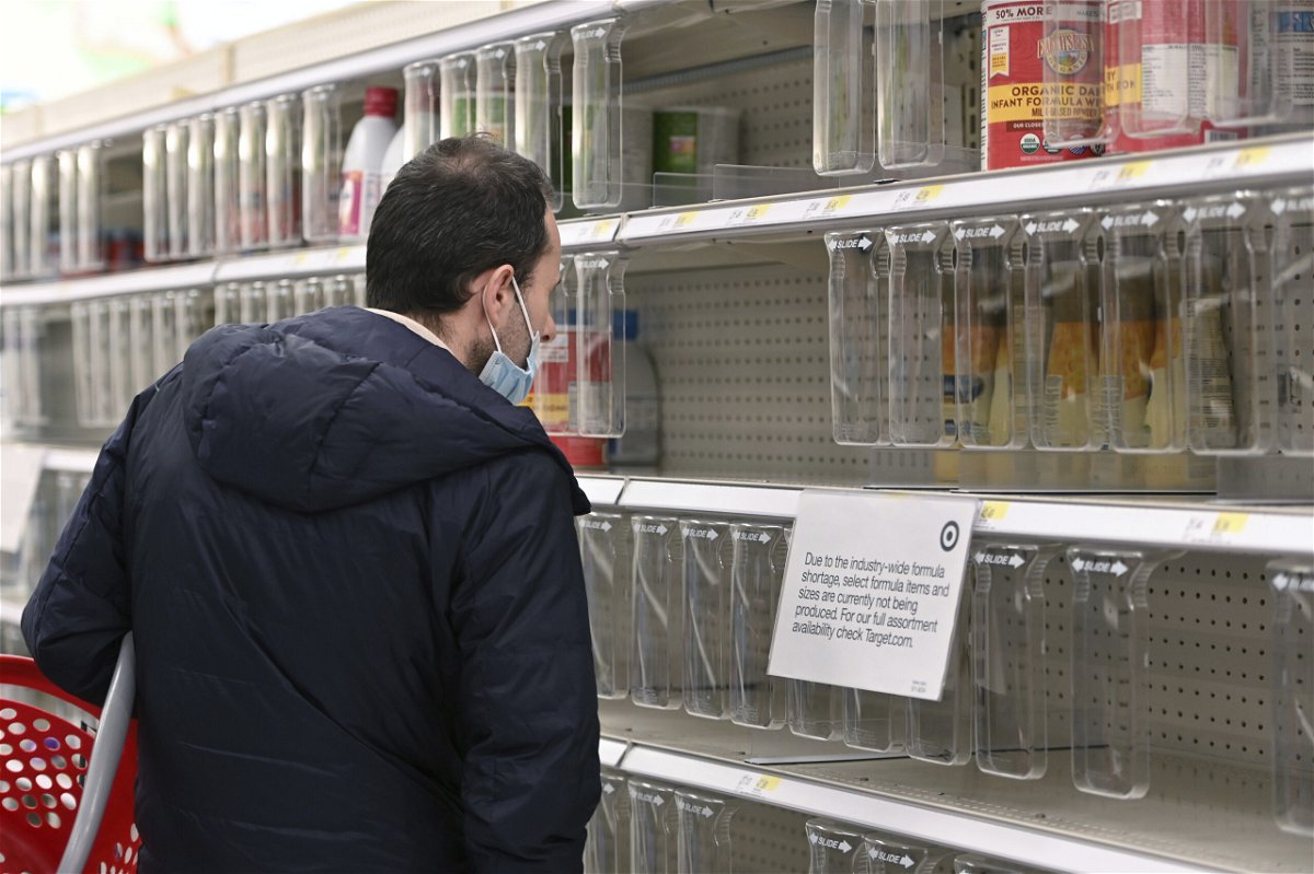 <i>Anthony Behar/Sipa USA/AP</i><br/>A man looks at a nearly empty baby formula shelves at a Target store in the Queens borough of New York City on May 10. The Biden administration is confronting a barrage of questions and criticism for the national baby formula shortage.