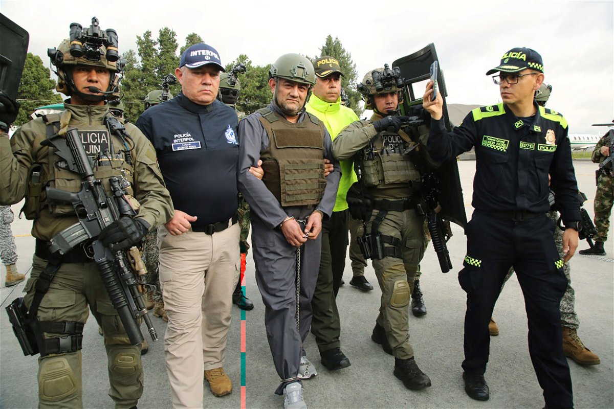 <i>Colombian Presidential Press Office/AP</i><br/>Police escort Dairo Antonio Usuga