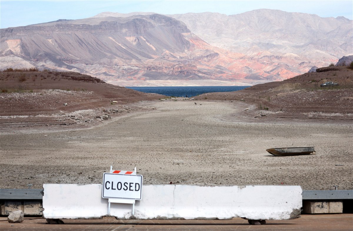 <i>Mario Tama/Getty Images</i><br/>Two sets of human remains have been discovered recently as Lake Mead continues to recede. A formally sunken boat rests on a section of dry lakebed along drought-stricken Lake Mead on May 9
