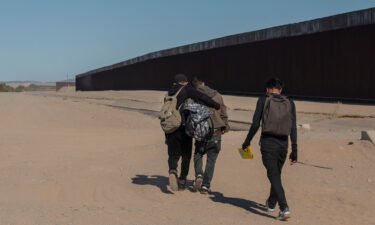 Nicaraguan migrants walk on the US-Mexico border